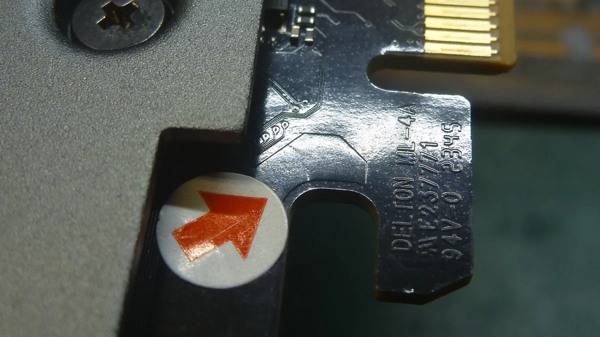 Close-up of a Delton ML-44 expansion card with visible gold contacts and the text 'DELTON ML-44 A4/G V2.3/77'.