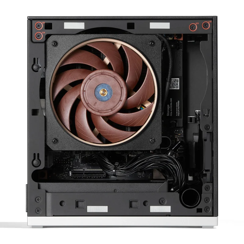 A Noctua NF-A12x25 fan installed inside a compact, black computer case, showcasing its fan blades and internal cabling.