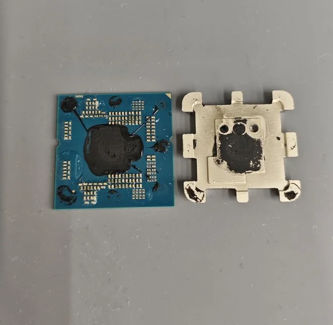 A dismantled chip exposing its internal components, including the silicon die and substrate, laid out side-by-side.