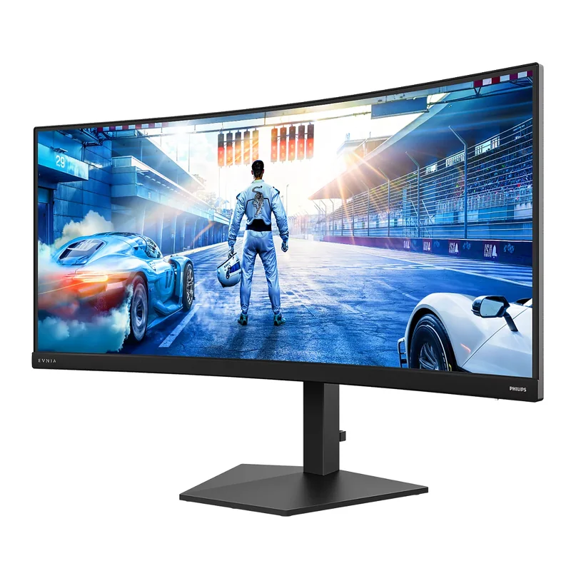 A Philips Evnia curved gaming monitor displays a racing game with a driver standing between two high-performance cars on a racetrack.